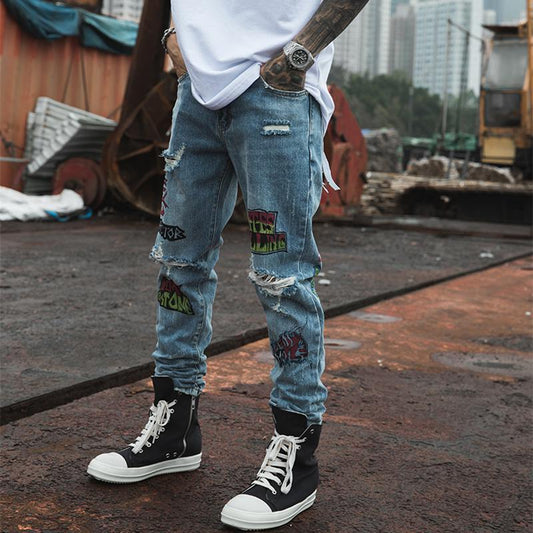 EXTINCTION DISTRESSED DENIM JEANS