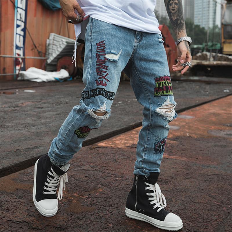 EXTINCTION DISTRESSED DENIM JEANS