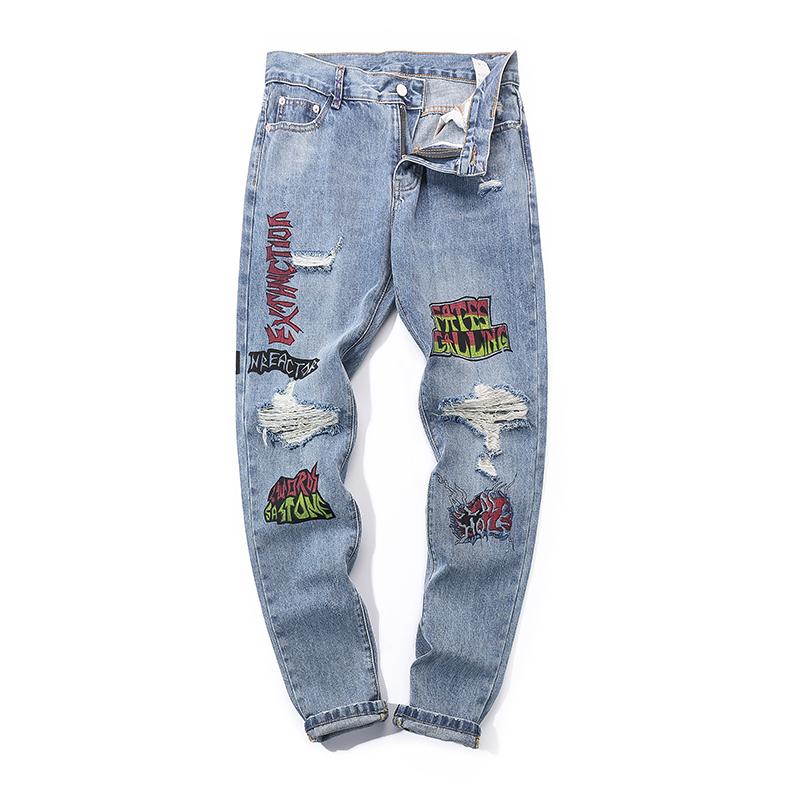 EXTINCTION DISTRESSED DENIM JEANS