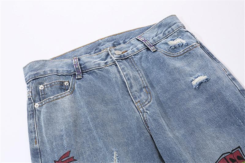 EXTINCTION DISTRESSED DENIM JEANS