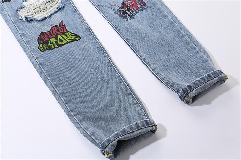 EXTINCTION DISTRESSED DENIM JEANS