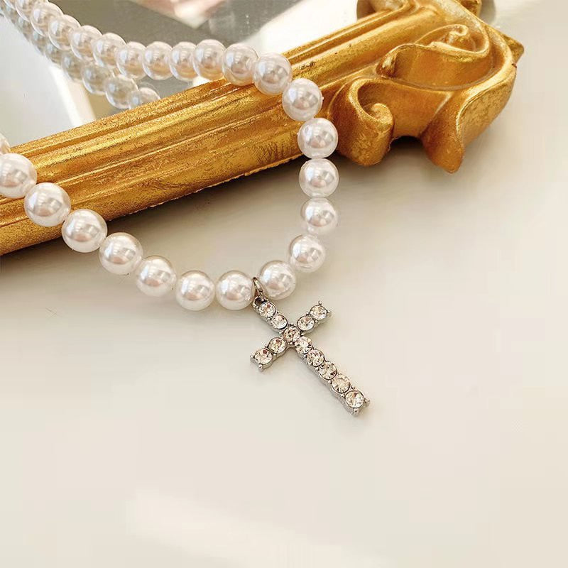 WHITE PEARLS CROSS NECKLACE