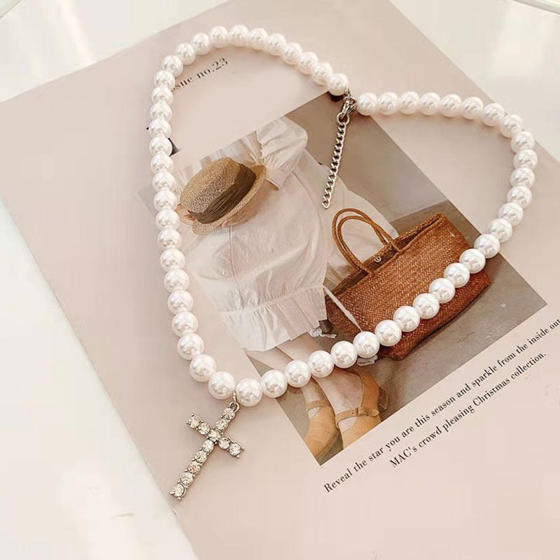 WHITE PEARLS CROSS NECKLACE