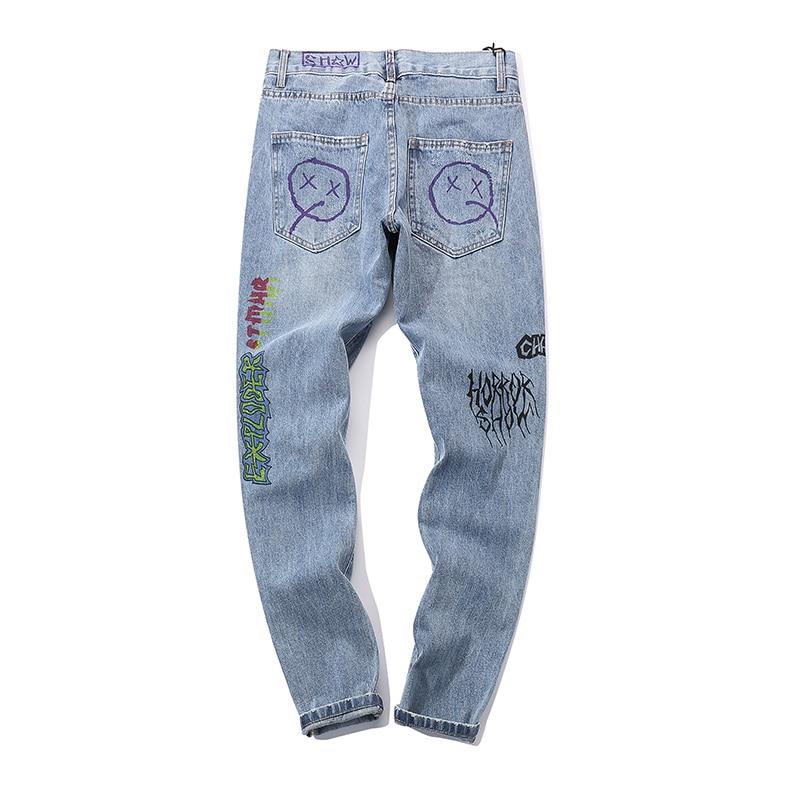 EXTINCTION DISTRESSED DENIM JEANS